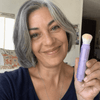 Beatriz Q, verified buyer, holding the Tone Adapting CC Serum setting powder